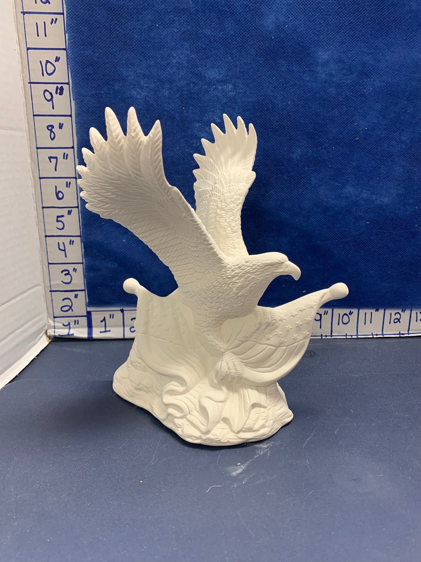 Eagle holding flag
