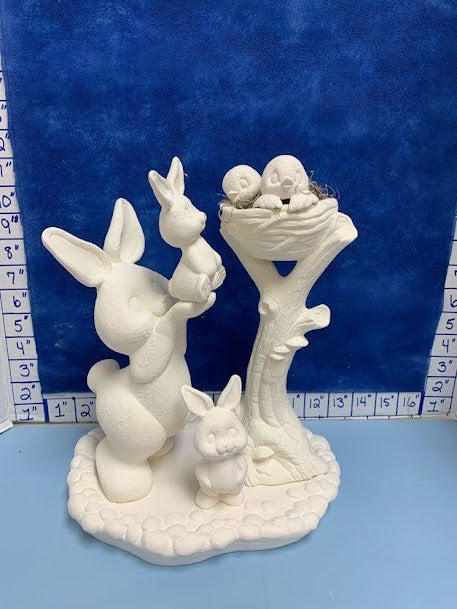 Bunny reaching with birds in nest set